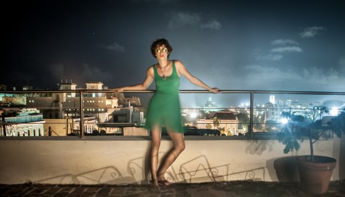Behind me you can see the lights of Viejo San Juan (Old San Juan). My skirt was blowing in the wind and because of the long exposure its blured.