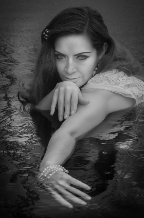 Creative Infrared Portrait of Mary Kate in the pool. Portrait and wedding photographer Rincon Puerto Rico.