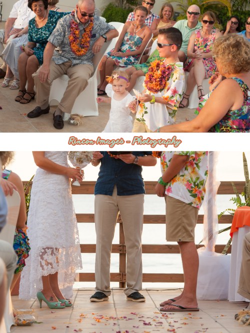 The tropical ring bearer and flower girl walking down the aisle at Villa Cofresit Resort and Hotel in Rincon, Puerto Rico. The sunset was perfect for a destination beach wedding in Rincon Puerto Rico. Wedding photography by Rincon Images wedding photography in Rincon Puerto Rico. Wedding photographer Rincon Puerto Rico.