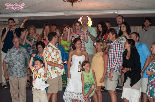 The bride and groom with their guests in the ballroom of Villa Cofresi Resort and Hotel in Rincon, Puerto Rico. Wedding photography by Rincon Images wedding photography. Wedding photographer Rincon Puerto Rico.