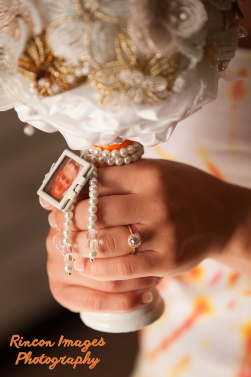 Bride holding a hand beaded bouquet