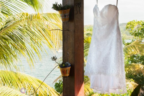 Lyndsays short lace wedding dress blowing in the island breeze. This wedding dress was the perfect choice for their Culebra Island wedding.