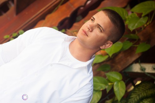 Marshall, the groom, enjoying a quiet moment before heading to the beach for the wedding.