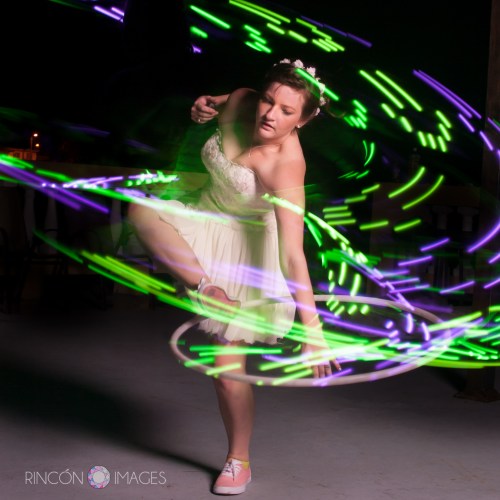 The bride hula hooping with an LED hula hoop after the wedding.