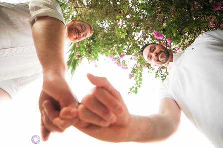 Best friends and partners for life! Cory and Steven are now a happily married couple. I took this playful wedding photograph with my fish eye lens. Photograph by Rincon Images LGBT wedding photographer Puerto Rico.