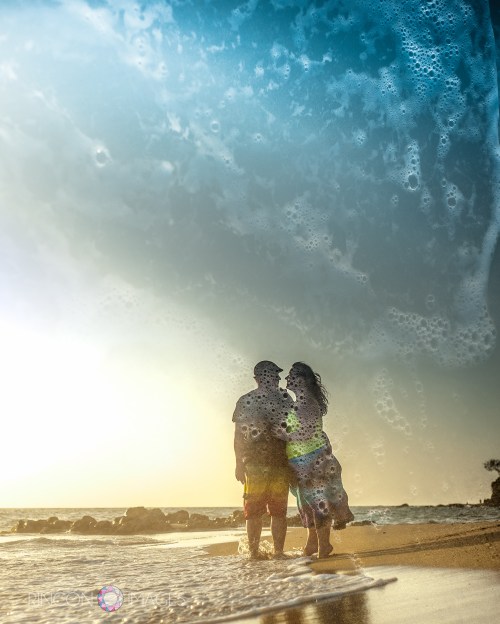 Bubbles and sea foam! The size relationship of the two frames combined here is what makes this image interesting. The tiny sea foam bubbles look larger than life agains the silhouette of the couple on the beach.  Photograph by Rincon Images wedding photographer Puerto Rico.